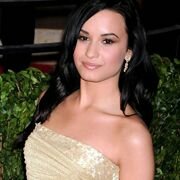 Demi Lovato bends over during a selfshooting session to show her cleavage