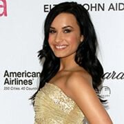 Demi Lovato bends over during a selfshooting session to show her cleavage