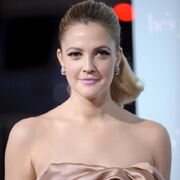 Drew Barrymore teases her fresh cleavage while dressed in a latex jacket